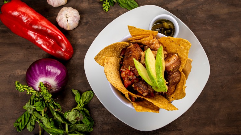 bowl of chifrijo and ingredients