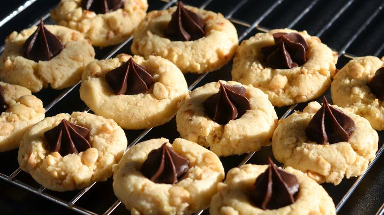 Chocolate thumbprint cookies on cooling rack