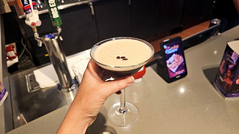 hand holding an espresso martini