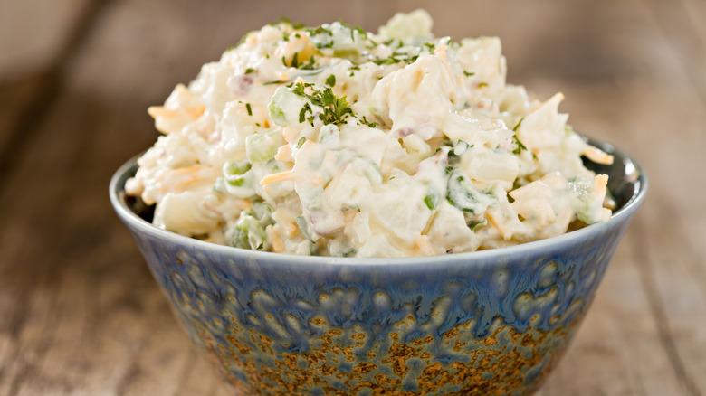 creamy potato salad in a blue bowl