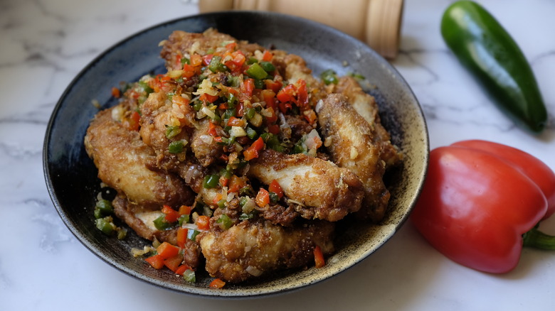 fried chicken wings with diced veggies