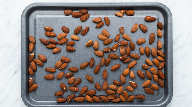 roasted almonds on a cookie sheet