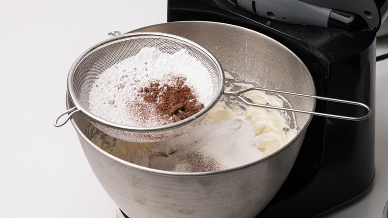 sifting sugar and cocoa powder