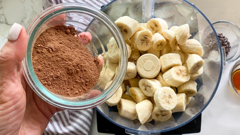 adding cacao powder to food processor