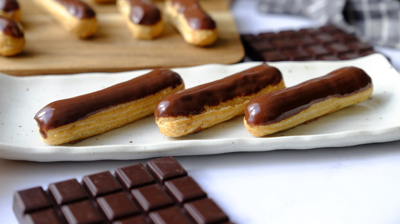 Finished mini eclairs sit on plate 