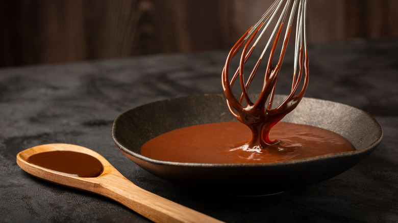 bowl with melted chocolate and whisk