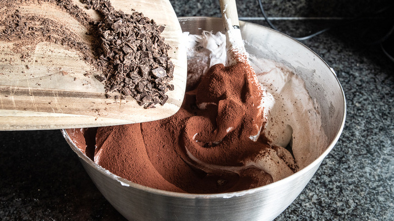 adding chocolate to bowl