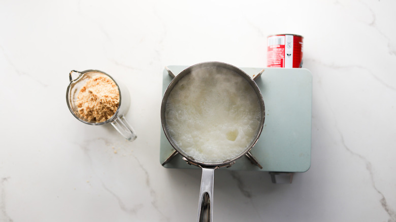 Cream heating in metal pot