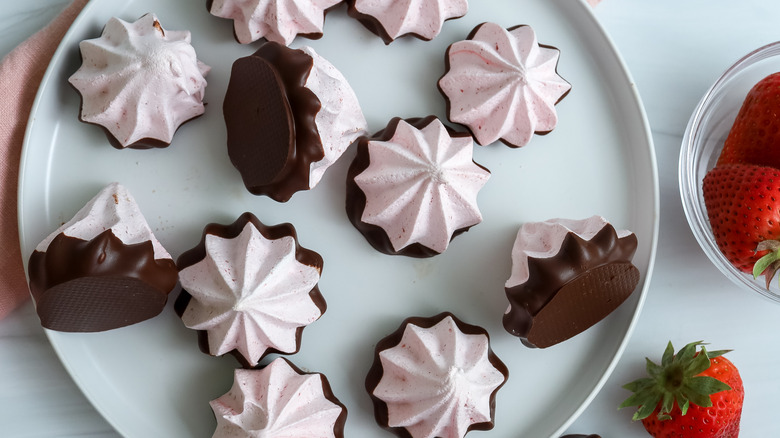 chocolate strawberry meringue cookies on a plate