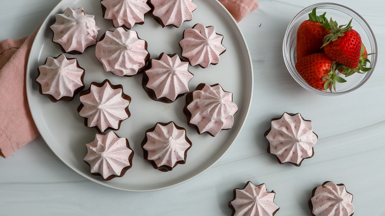 chocolate strawberry meringue cookies on a plate