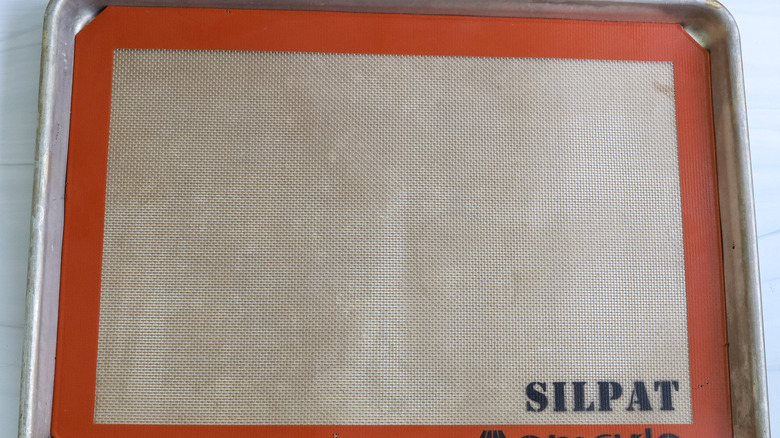 a baking pan with a silpat mat on it