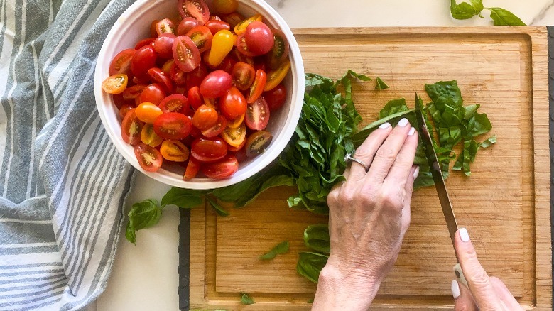 cut tomatoes and basil