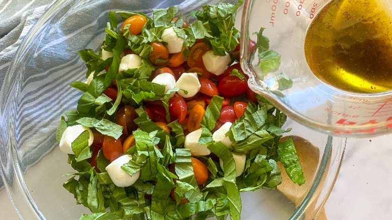 dressing going into salad