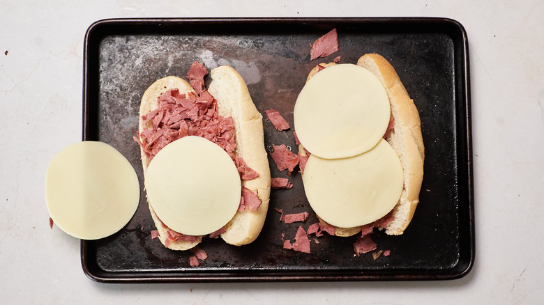 pastrami with cheese on sheet tray