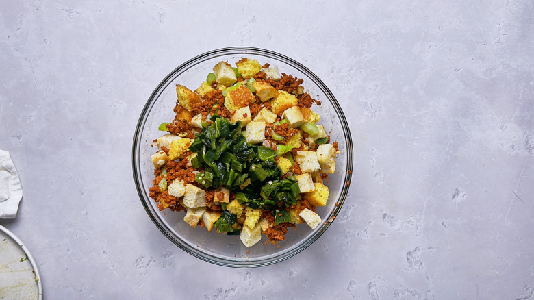 peppers in a bowl with bread cubes