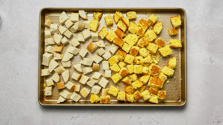 bread cubes on a baking sheet