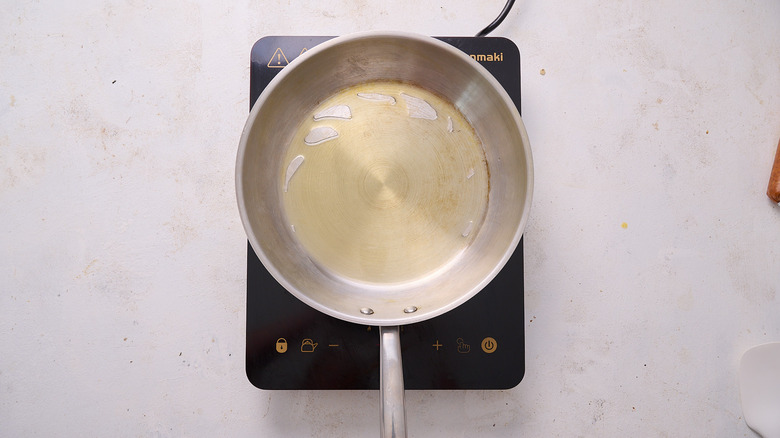 heating oil in a skillet