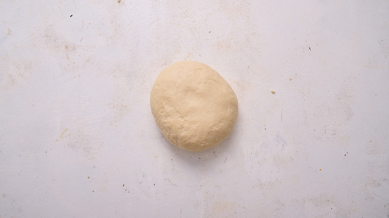 disc of dough on table