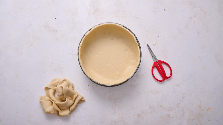 pressing dough into springform pan