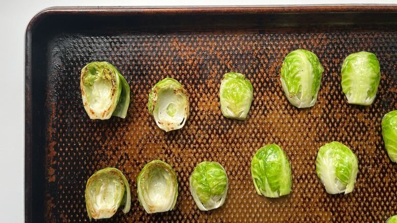 lightly browned Brussels sprouts on a baking sheet