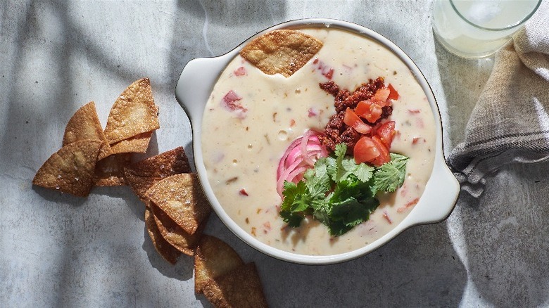 queso on a table with chips