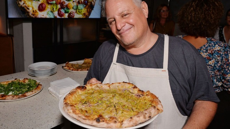 Chris Bianco holding the Rosa pizza