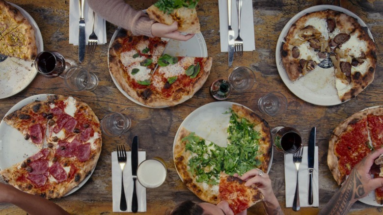 Table with different pizzas