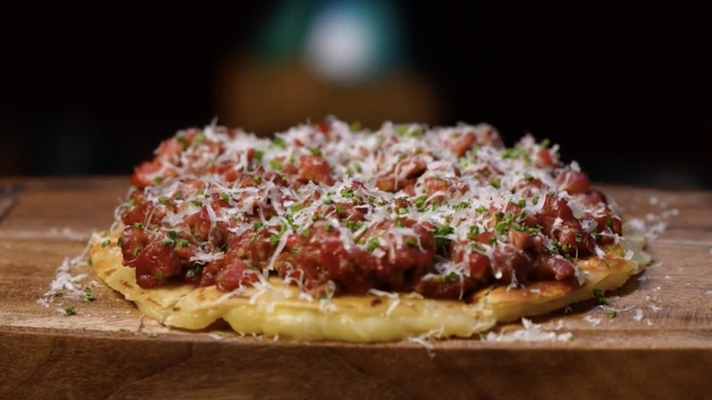 Steak tartare quesadilla on wooden board