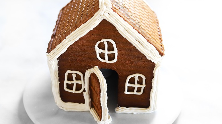 undecorated gingerbread house with icing