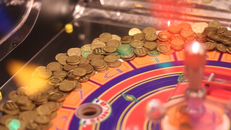 Chuck E. Cheese arcade game full of tokens