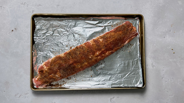 seasoned ribs on baking sheet