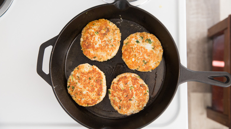 4 fish burgers in pan