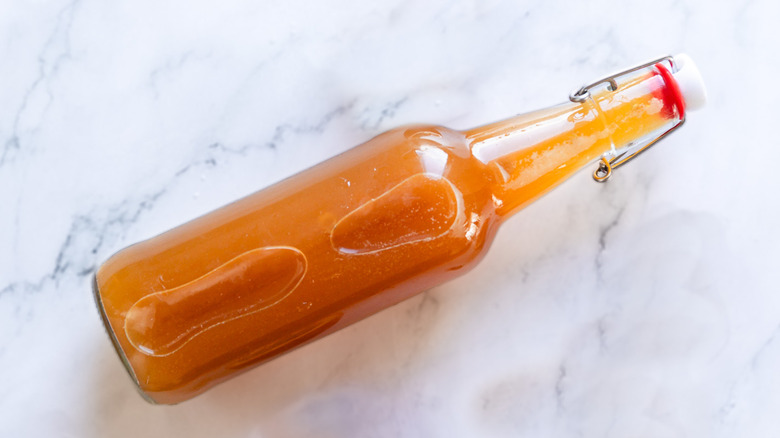 Sealed kombucha bottle on counter