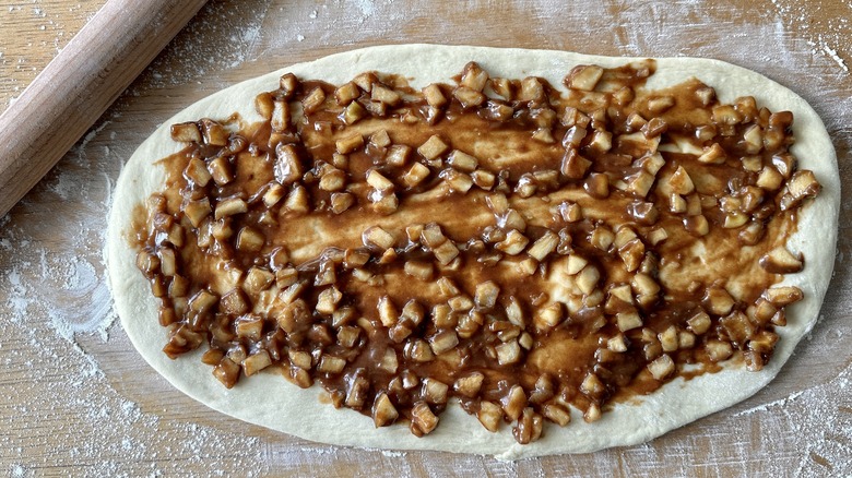 Apple filling over bread dough