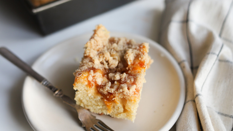 Slice of jammy peach cake