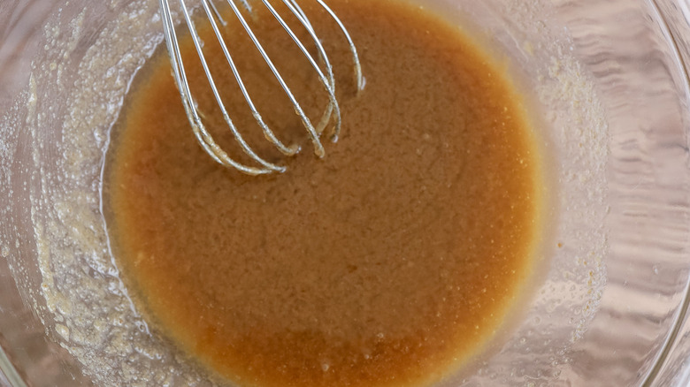 buttery sugar mixture with whisk