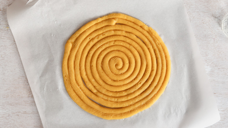 churro piped into a large swirl