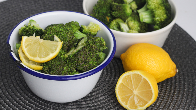 broccoli and lemon in bowls