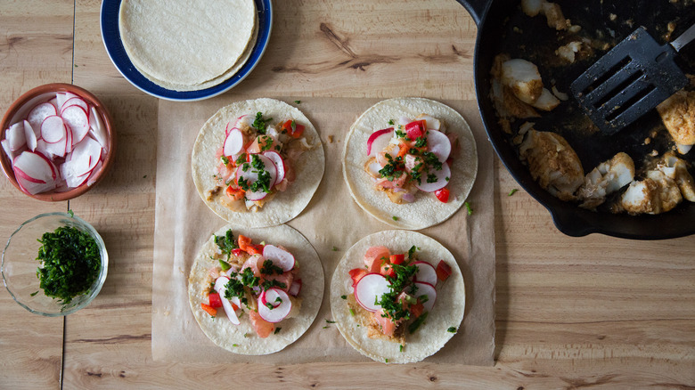 4 fish tacos on table 