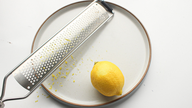 lemon and grater on plate