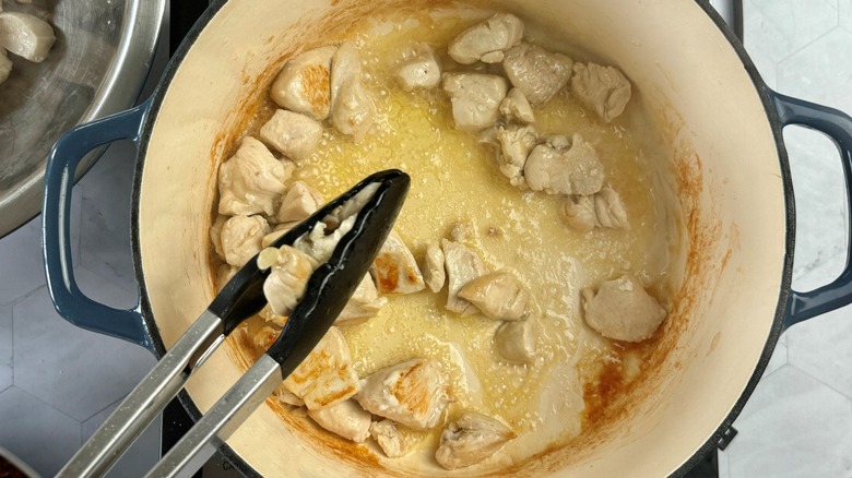 chicken chunks cooking in pot