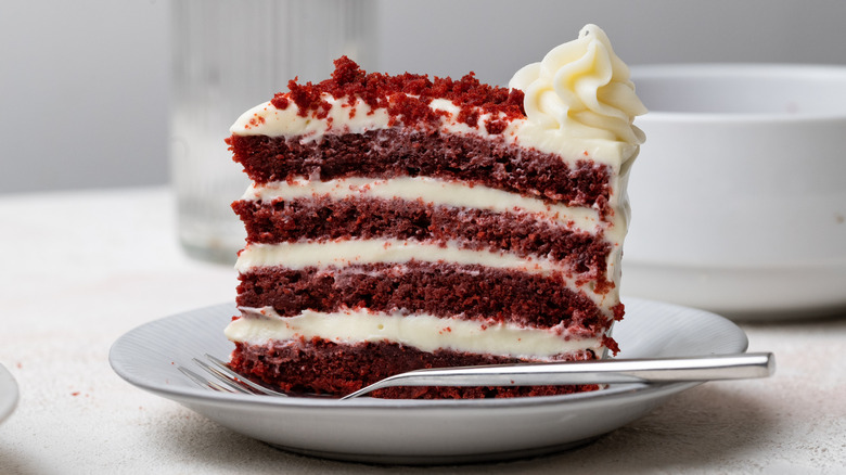 slice of red velvet cake on plate 