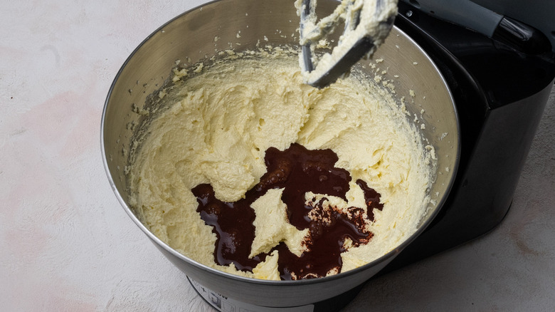 stand mixer containing cake ingredients 