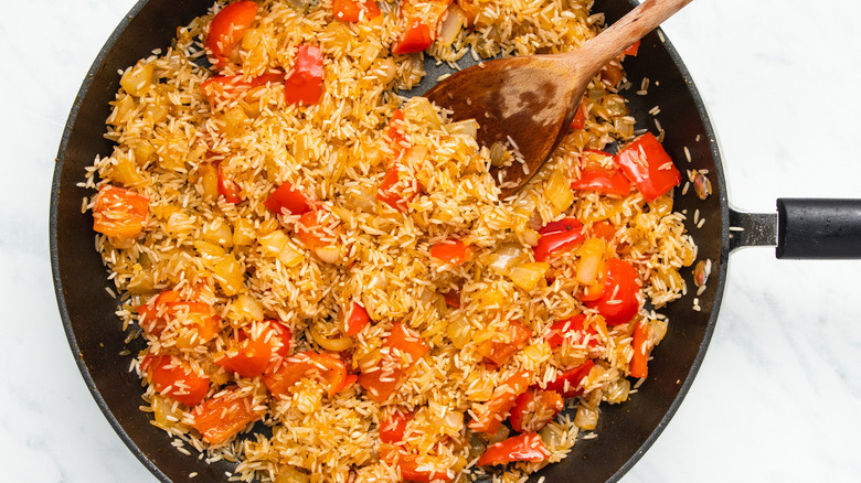 rice and veggies in pan 