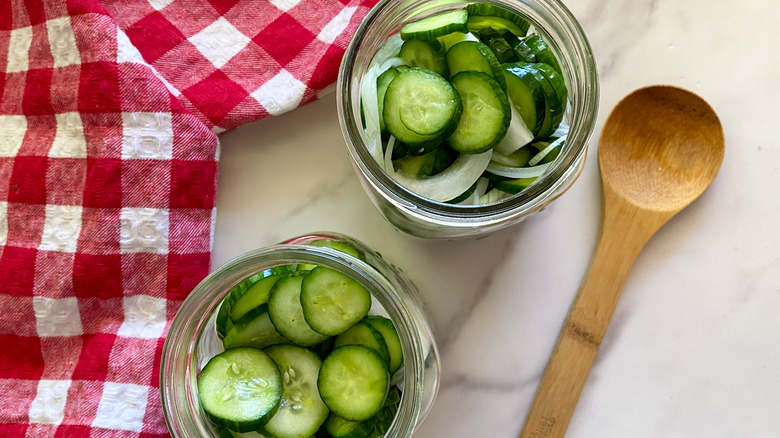 pickles in two mason jars