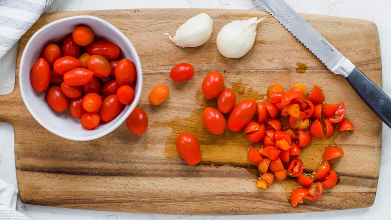 cherry tomatoes on cutting board