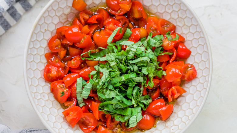 tomatoes and basil in bowl