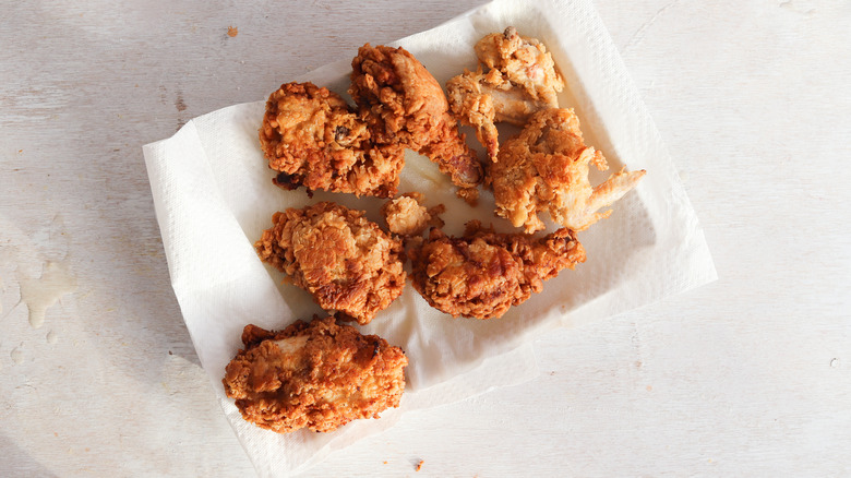 fried chicken on paper towel–line plate
