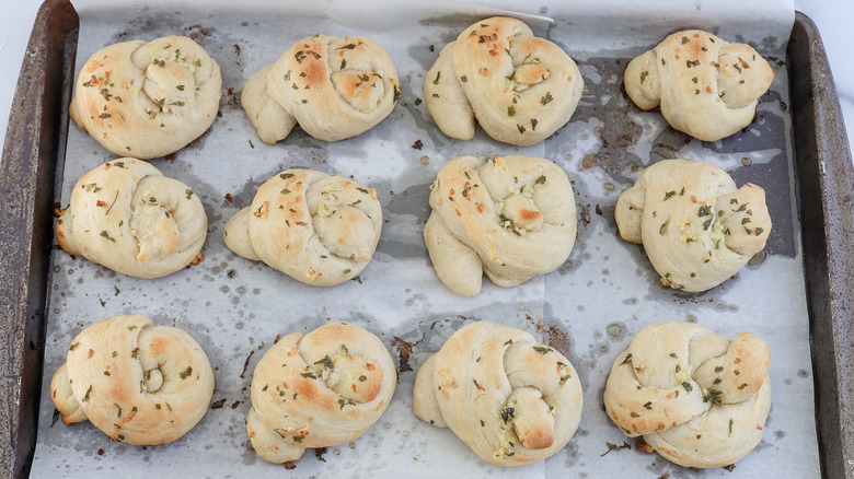 baked garlic knots on sheet