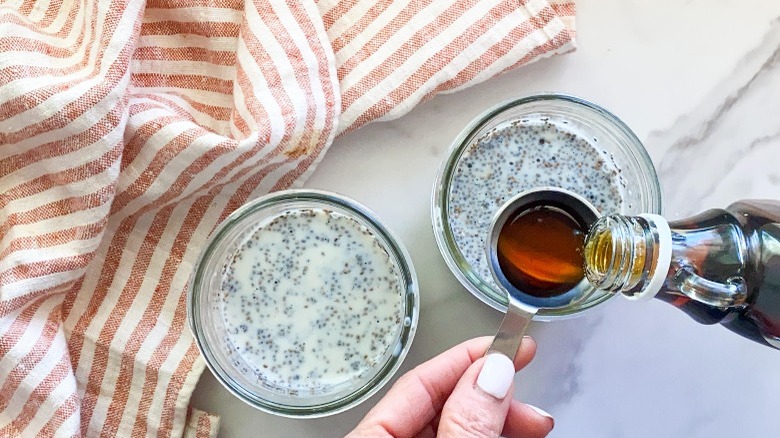 chia seeds, milk, syrup in jars